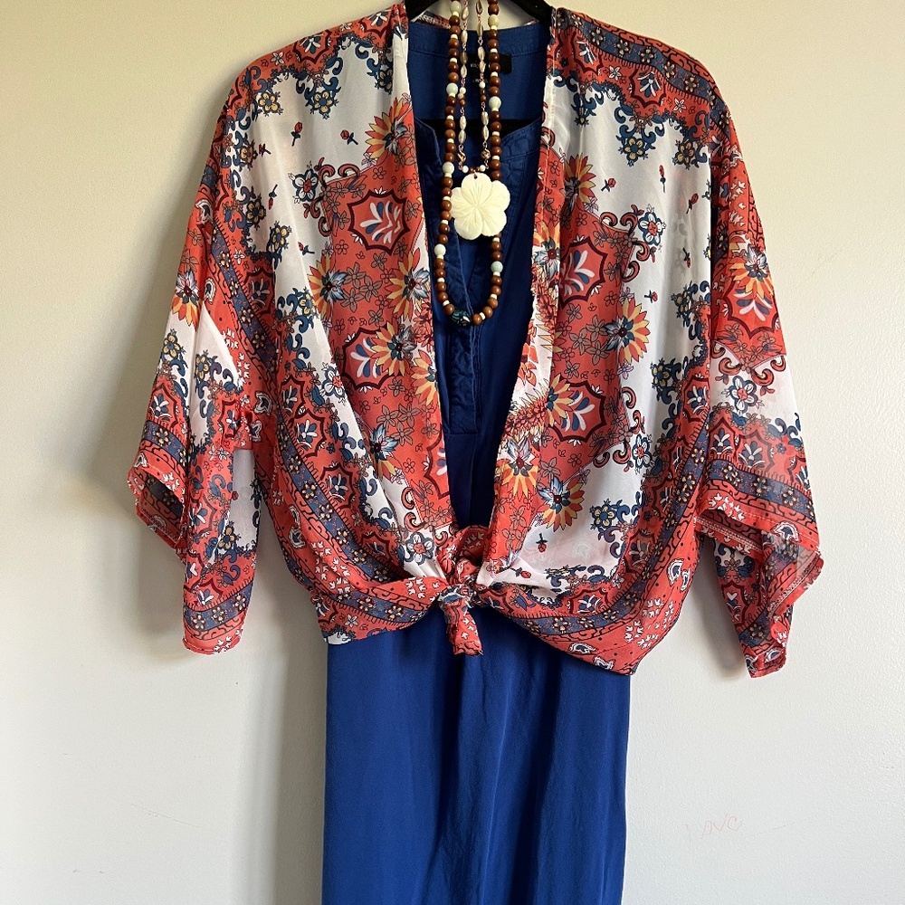 Sleeveless “Violet B” Blue Tunic Top with high low details.